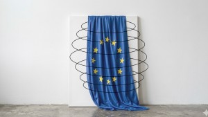 Europe flag, hung over a white canvas, surrounded by black ellipses