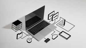 Laptop surrounded by drawn Application connected to AI