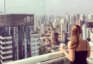 a female person with her back to the viewer looking at a skyline