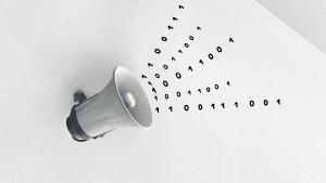 Megaphone with code emerging from it