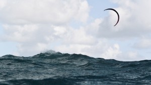 Kite flying over rough water